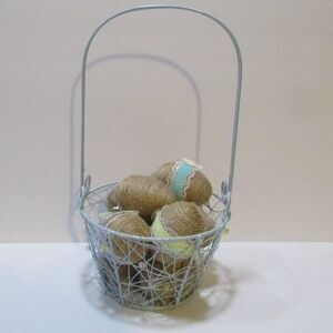 blue metal beaded Easter basket with twine wrapped eggs spring farm country